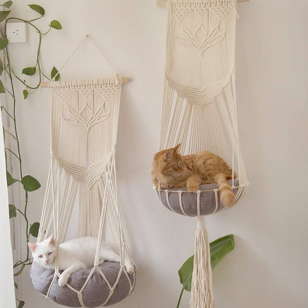 This HANGING CAT HAMMOCK Lets Kitties Observe Their Lowly Peasant